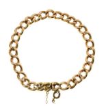 Early 20th Century gold bracelet, stamped '15ct', of hollow curb links to a hidden box clasp, 19.5cm