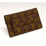 Louis Vuitton monogrammed purse, having orange inner leather lining, and brass stud fastener, 18cm
