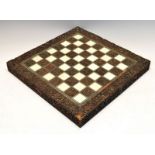 Late 19th Century Indian (Vizagapatam) ivory-mounted carved wooden chess board, having thirty-two