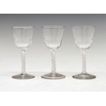 Three air-twist cordial glasses, each with panel-moulded rounded funnel bowl on single series air-