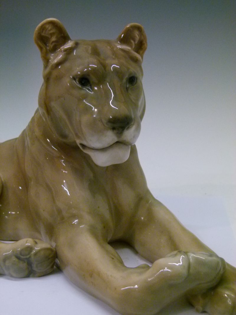 Royal Copenhagen porcelain figure of a lioness, modelled in recumbent pose, with printed and painted - Image 3 of 6