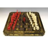 19th Century Chinese Canton carved ivory chess set, red-stained and natural, the Kings 11.5cm