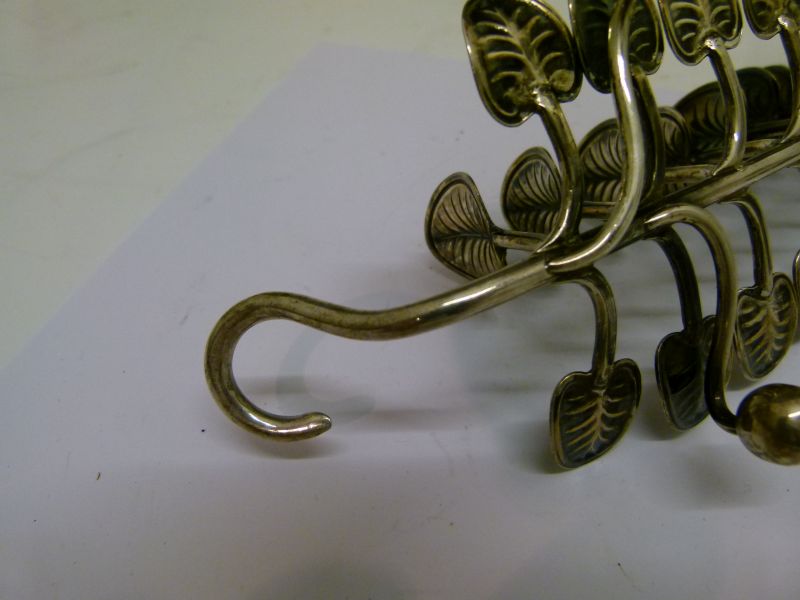 Victorian silver toast rack, having seven branches with lily pad terminals standing on four ball - Image 5 of 6