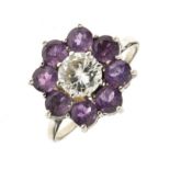 Diamond and amethyst cluster ring, stamped 'Platinum', the central brilliant cut, measuring