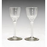 Pair of air twist cordial glasses, with rounded funnel bowls on double series air-twist stems,