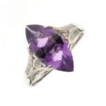 Amethyst and diamond 18ct white gold dress ring, claw set with a multi facet marquise shaped