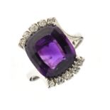 Amethyst and diamond dress ring, the white cross over mount stamped '750', the rectangular cut stone