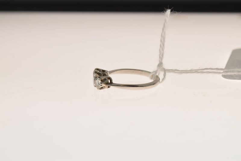 Three stone diamond ring, the white mount stamped 'atinum' having been sized, the graduated - Image 2 of 6