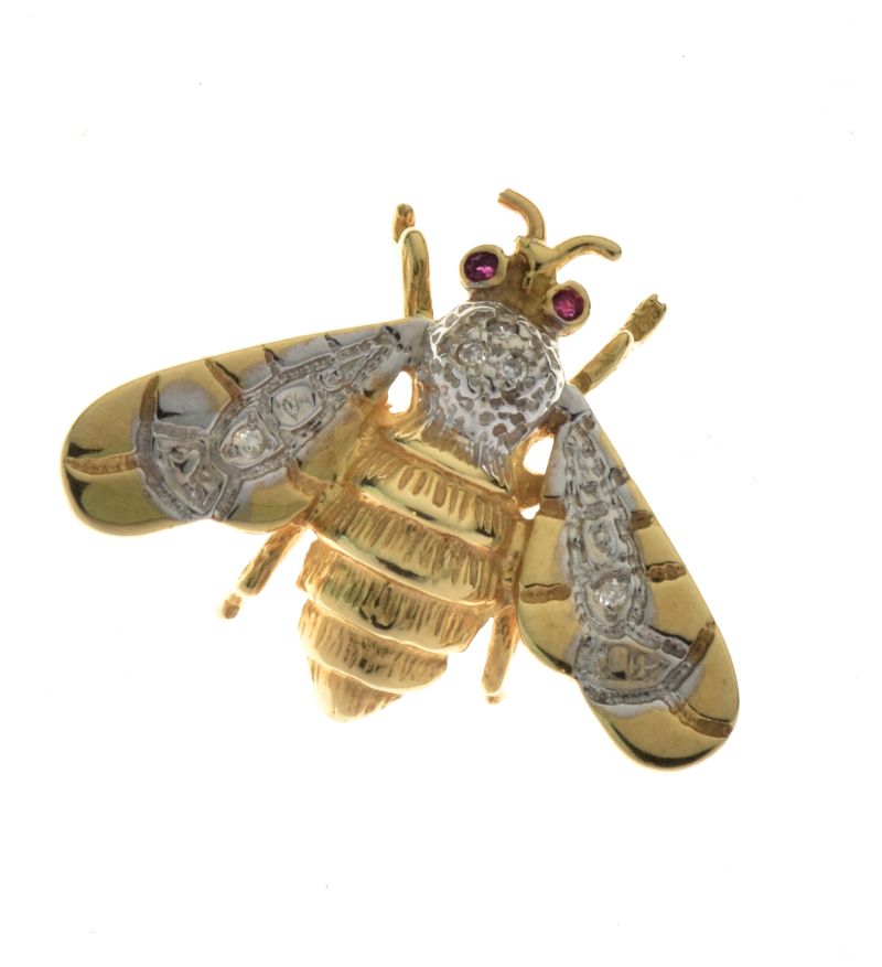 Diamond and ruby set bee brooch, stamped '14k', 'J.M.' and copyright mark, a diamond to each wing