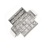 Pave set diamond cluster ring, the white mount stamped '750', the rectangular head set with thirty