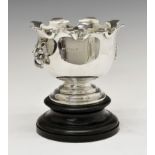 George V silver Monteith style bowl standing on raised circular foot with lion mask handles,