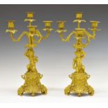 Pair of late 19th Century ormolu and gilt spelter four-branch figural candelabra, each cast as a