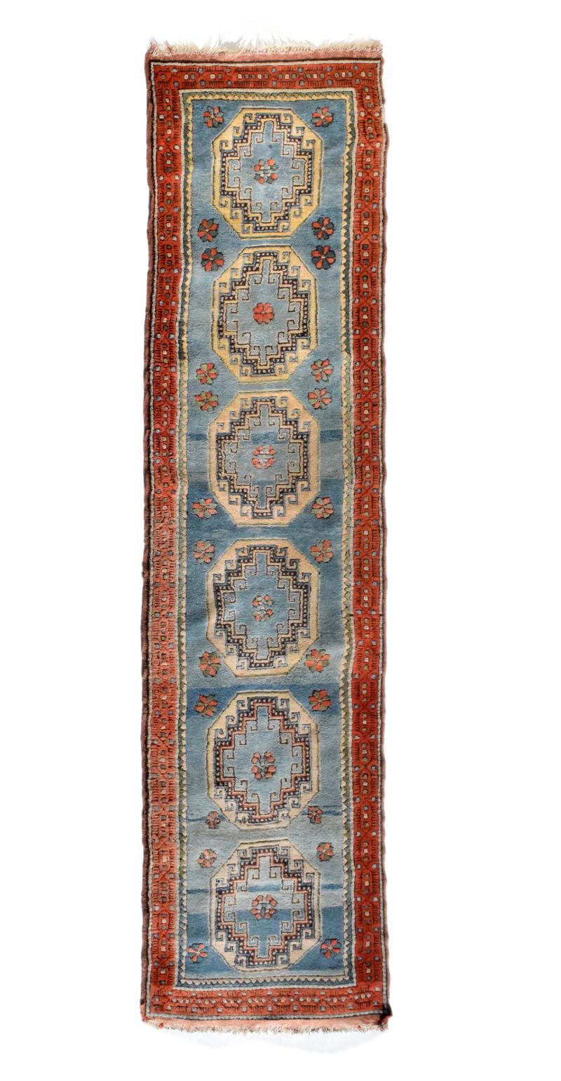 Middle Eastern (North West Persian) wool runner, the powder-blue field decorated with six large