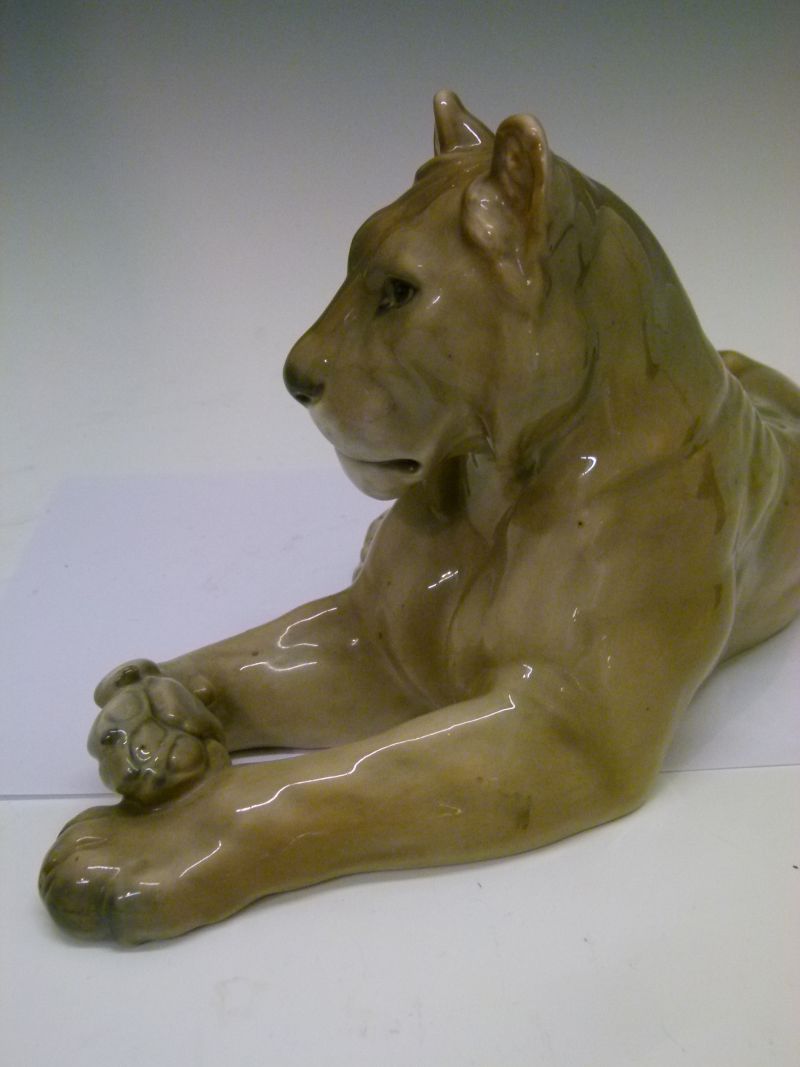 Royal Copenhagen porcelain figure of a lioness, modelled in recumbent pose, with printed and painted - Image 4 of 6