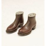 Pair of World War I prisoner-of-war novelty snuff boxes, in the form of leather boots, the oval