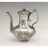 Early 20th Century Chinese white metal coffee pot having relief decoration of a dragon and