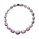 Victorian amethyst riviere necklace, the twenty-one graduated oval cut collet set in unmarked