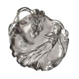WMF Art Nouveau pewter tray, shape 290, modelled in relief with a maiden in flowing gown beside a