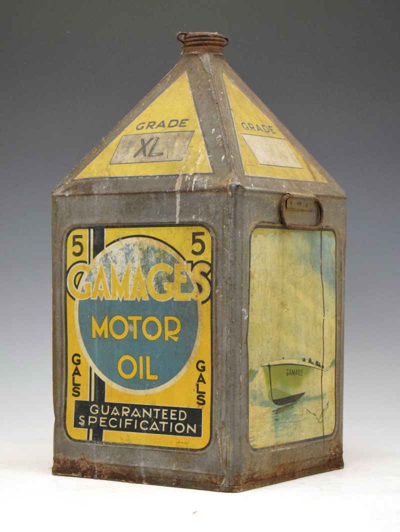 Advertising - Vintage grade XL Gamages pyramid motor oil can, decorated with racing car, seaplane