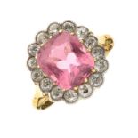 Pink tourmaline and diamond cluster ring, stamped '18ct', the tourmaline measuring approximately 9.