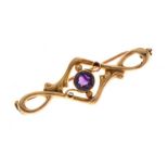 Amethyst brooch, the round cut stone to a sinuous leaf frame tagged '15ct', 4cm long, 2.4g gross