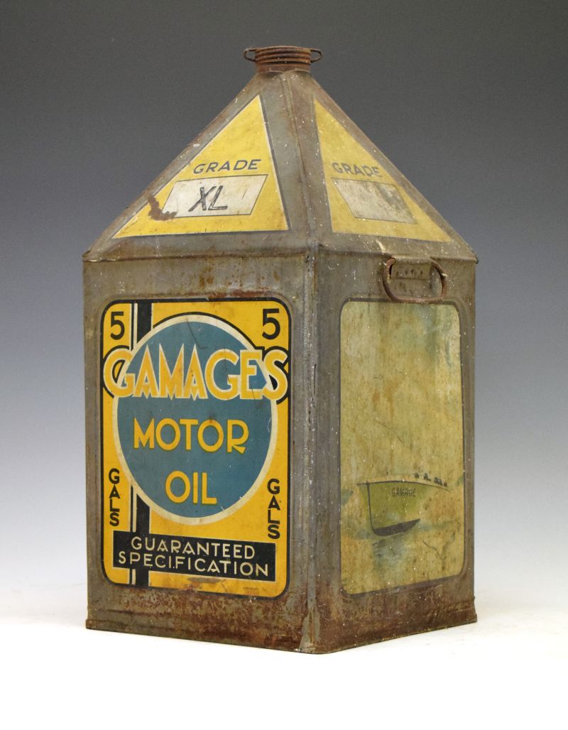 Advertising - Vintage grade XL Gamages pyramid motor oil can, decorated with racing car, seaplane