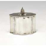 Edward VII silver tea caddy of fluted oval form, the hinged lid with pineapple shaped finial, London