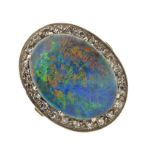 Opal triplet and diamond cluster ring, stamped '18ct', the large oval triplet enclosed by twenty-