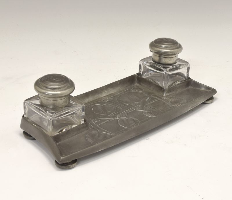 Liberty & Co Tudric pewter inkstand or deskstand, fitted two inkwells flanking foliate relief