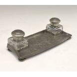Liberty & Co Tudric pewter inkstand or deskstand, fitted two inkwells flanking foliate relief