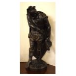 Late 19th Century bronzed iron figure of a gentleman drawing his sword, 45cm high