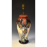 Moorcroft Tulip pattern baluster shaped vase, 32cm high to base of brass light fitting