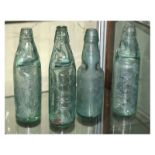Two Clevedon glass bottles, and two others