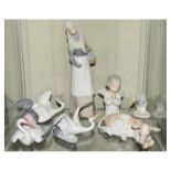Lladro - Seven figures comprising; Girl with Puppy, Angel, Three Cranes, Goose and Cow