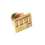 Yellow metal tie pin of rectangular design with initials ITT and small diamond to corner, stamped