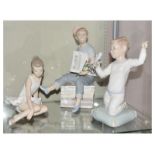 Nao - Three figures - Ballerina, Paperboy, and Child with bird, the tallest standing 23.5cm high