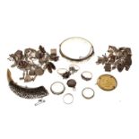 Assorted silver and white metal jewellery to include; Boar tusk brooch, snap bangle, two charm