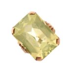 Yellow metal dress ring set large pale yellow/green emerald-cut stone, shank stamped 9ct, size P,