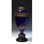 19th Century French Sevres porcelain urn and cover, mazarin blue with gilt enrichment, brown printed