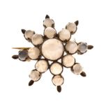 Unmarked yellow metal bar brooch of eight-pointed star design set with moonstone-type cabochons, 6.