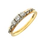 Yellow metal and three stone diamond ring, the stones set between silvered ball ornaments, shank