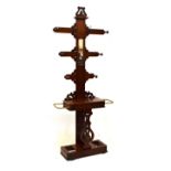 Victorian mahogany hallstand with rectangular mirror between coat hooks and knobs over hinged