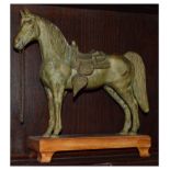 Oriental cast metal figure of a standing horse with detachable saddle on wooden plinth, overall