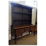 Antique oak dresser, the plate rack fitted two shelves, the base with five drawers, on turned