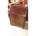 A 20th century mahogany miniature bureau