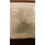 A framed map depicting "The County of Ca