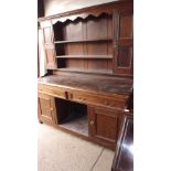 An antique oak Welsh dresser with 3 shel