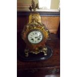 A 19th century French mantel clock in cl