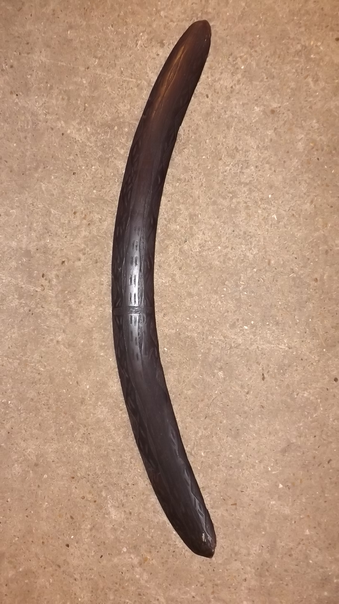 A 19th century wooden boomerang with con