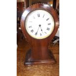 A small Edwardian mahogany mantel clock